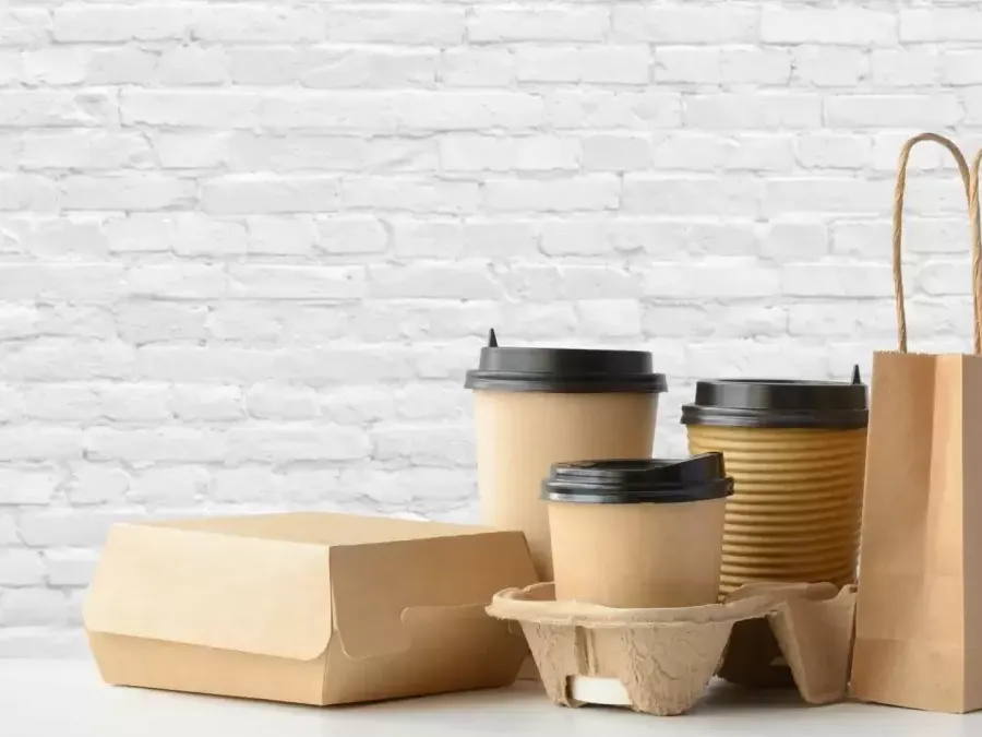 Kraft paper bags, cartons and cups bonded with water-based adhesives